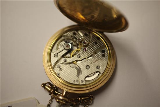 A gentlemans 9ct gold keyless lever dress pocket watch and chain.